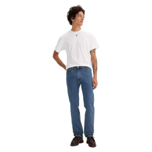 Translation missing: en.A man wearing a white crew-neck t-shirt, blue jeans, and brown leather shoes, standing against a solid white background